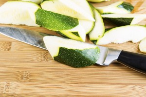 Zucchini Slices on Cutting board with Large Knife