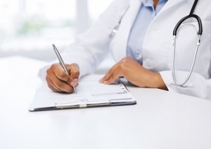 female doctor writing prescription