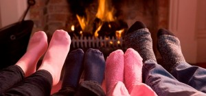 bigstock-Families-Of-Feet-Warming-At-A-4135281